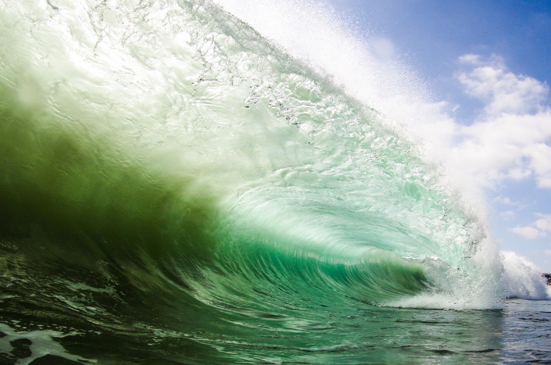 Powerful ocean wave crashing at Newport Beach, CA, showcasing the beauty of nature.